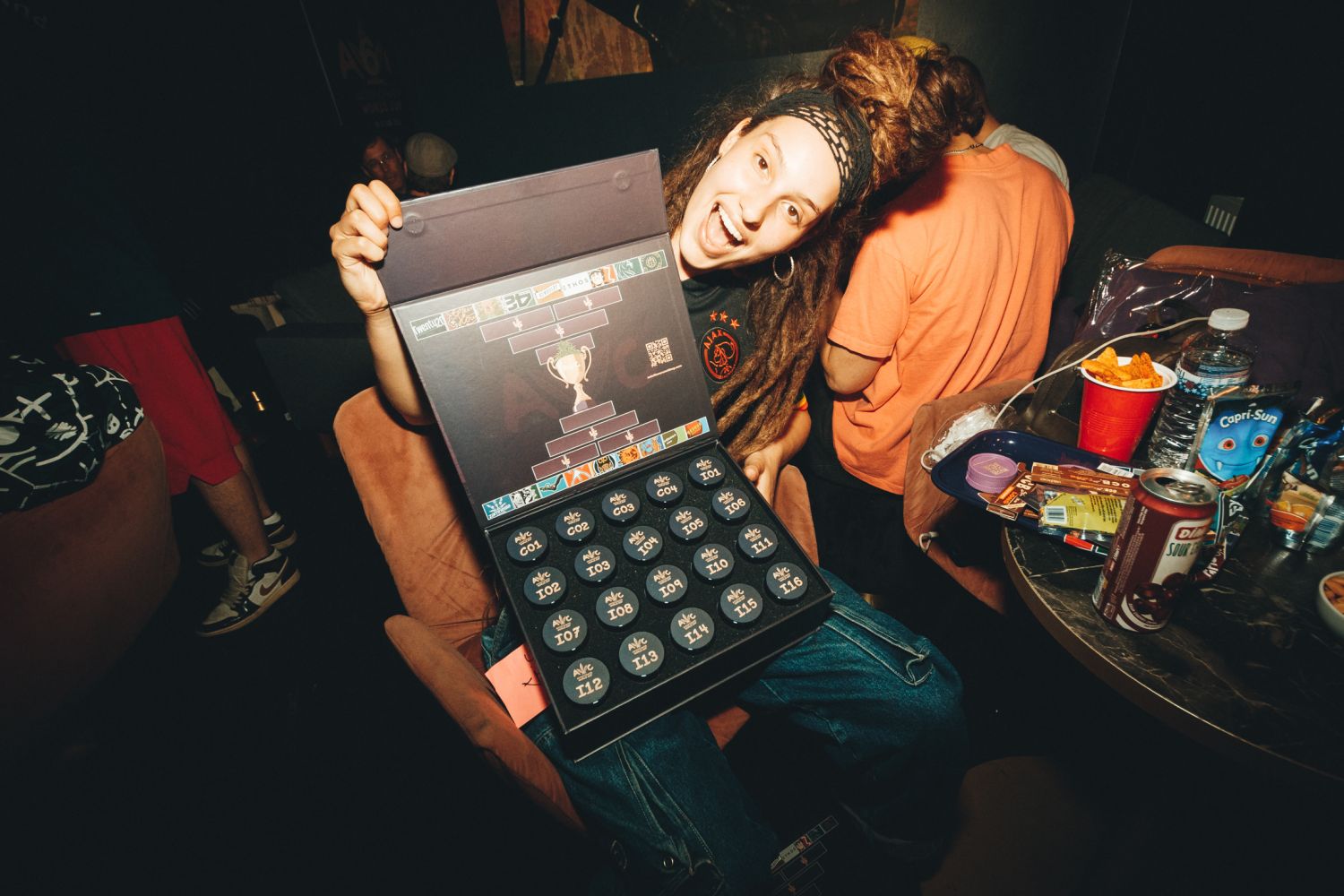 Stephanie holding an Autoflower World Cup judging kit with numbered samples at the 2026 event