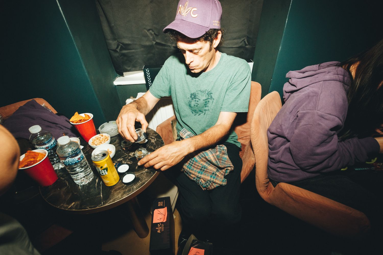 Cannabis judge sampling entries at a table during the 6th Annual Autoflower World Cup in Berlin